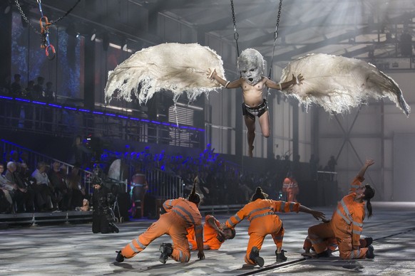 Artists perform during the opening show directed by German director Volker Hesse, on the opening day of the Gotthard rail tunnel, the longest tunnel in the world, at the fairground Rynaecht at the nor ...