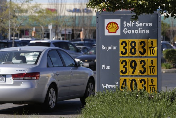 In this photo taken Friday March 7, 2014, gas prices are displayed at a Shell station in Sacramento, Calif. Starting 2015 California motorists will be hit in the pocketbook by the state&#039;s greenho ...