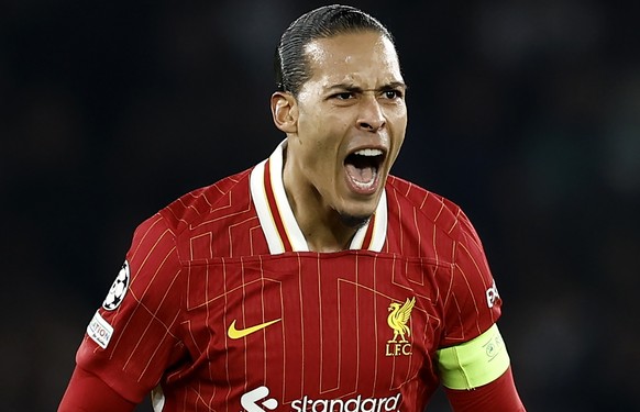 epa11943247 Liverpool captain Virgil van Dijk celebrates the opening goal of his team during the UEFA Champions League Round of 16, 1st leg soccer match between Paris Saint-Germain and Liverpool FC, i ...