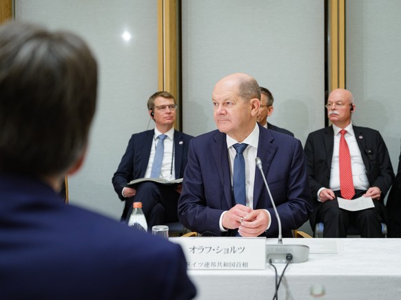 epa10529649 German Chancellor Olaf Scholz (C) attends a meeting with business partners from Germany and Japan during the Germany-Japan Summit at prime minister&#039;s official residence in Tokyo, Japa ...