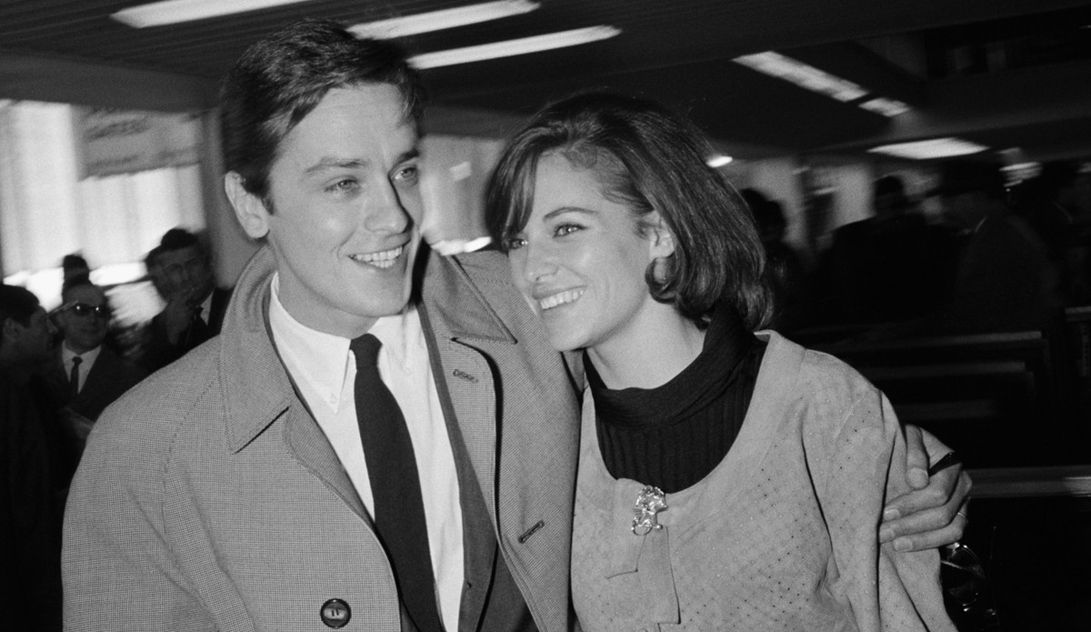 French actor Alain Delon and his wife actress Nathalie Delon at Orly Airport. (Photo by Henri Bureau/Sygma/Corbis/VCG via Getty Images)