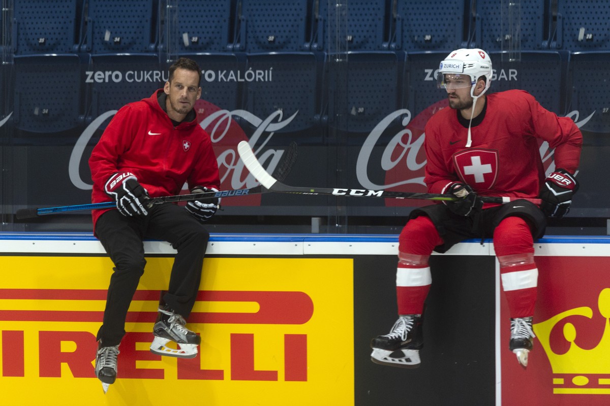 Switzerland's coach Patrick Fischer and Switzerland's Vincent Praplan during a training session of the Swiss team at the IIHF 2019 World Ice Hockey Championships, at the Ondrej Nepela Arena  ...