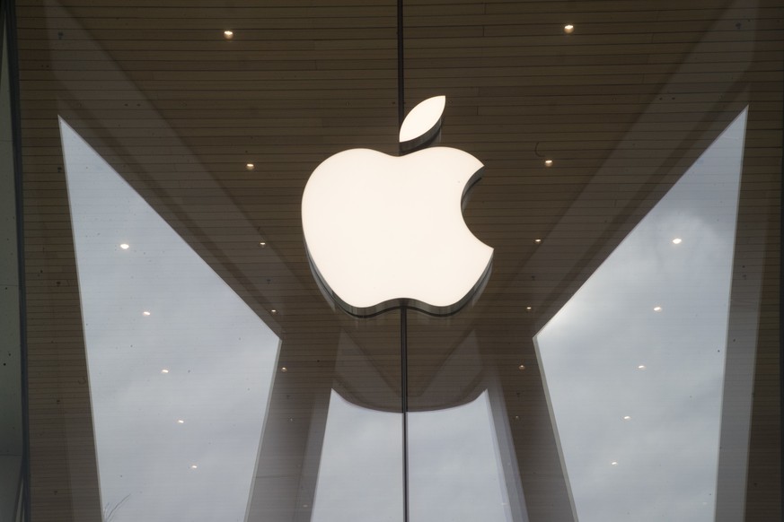FILE- In this Jan. 3, 2019, file photo the Apple logo is displayed at the Apple store in the Brooklyn borough of New York. European Union fines Apple nearly $2 billion for unfairly favoring its own mu ...