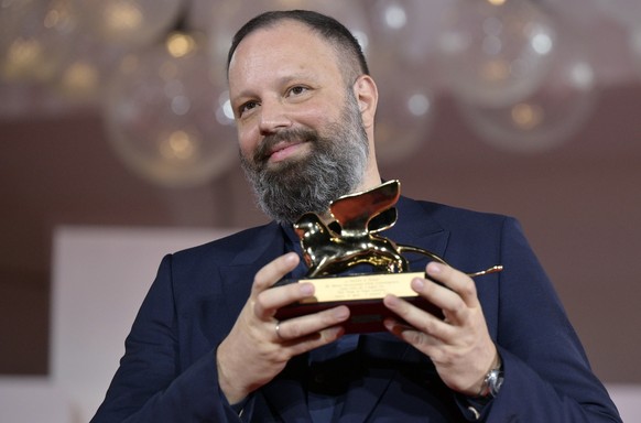 epa10851318 Greek filmmaker Yorgos Lanthimos holds the Golden Lion award for his movie &#039;Poor Things&#039; at the closing and awards ceremony of the 80th annual Venice International Film Festival, ...