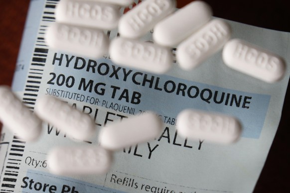 This Monday, April 6, 2020, photo shows an arrangement of Hydroxychloroquine pills in Las Vegas. President Donald Trump and his administration are keeping up their out-sized promotion of the anti-malaria drug not yet officially approved for fighting the new coronavirus, but scientists say more testing is needed before it's proven safe and effective against COVID-19. (AP Photo/John Locher)