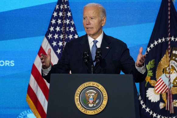 epa11831767 US President Joe Biden speaks at the US Conference of Mayors in Washington, DC, USA, 17 January 2025. The conference brings together mayors from across the United States to discuss common  ...