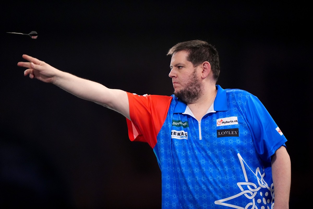 Stefan Bellmont celebrates during his first round match against Jermaine Wattimena during day one of the Paddy Power World Darts Championship at Alexandra Palace, London. Picture date: Sunday December ...