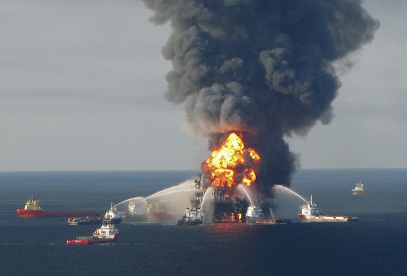 Fire boat response crews battle the blazing remnants of the offshore oil rig Deepwater Horizon, off Louisiana, in this April 21, 2010 file handout image. - BP was "grossly negligent" for its ...