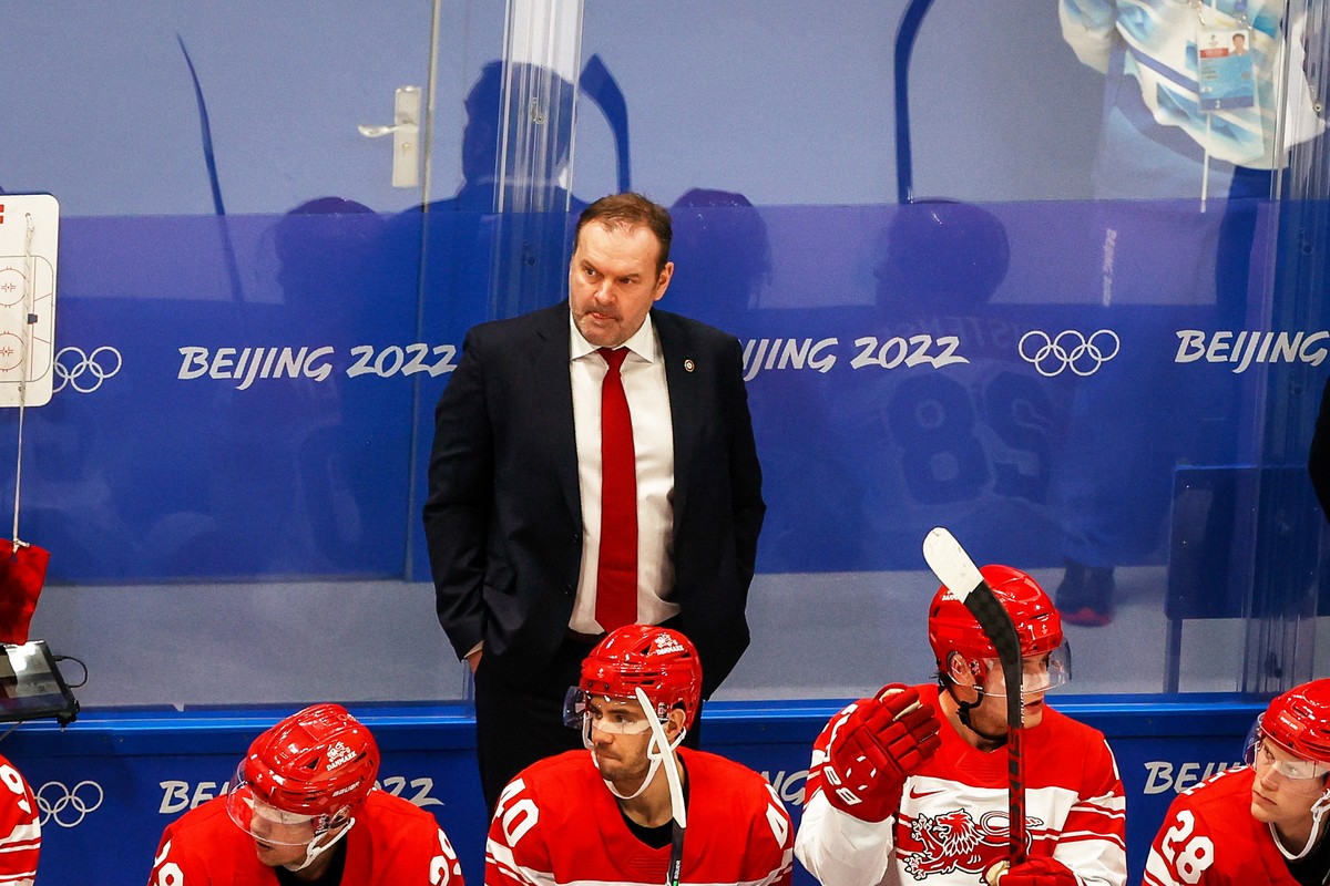epa09741510 Denmark's head coach Heinz Ehlers looks on during the Men's Ice Hockey preliminary round match between the Czech Republic and Denmark at the Beijing 2022 Olympic Games, Beijing,  ...