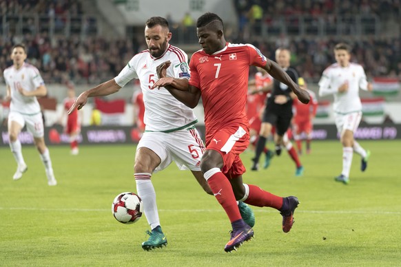 Hungary&#039;s Attila Fiola, left, fights for the ball against Switzerland&#039;s Breel Embolo, right, during the 2018 Fifa World Cup Russia group B qualification soccer match between Hungary and Swit ...