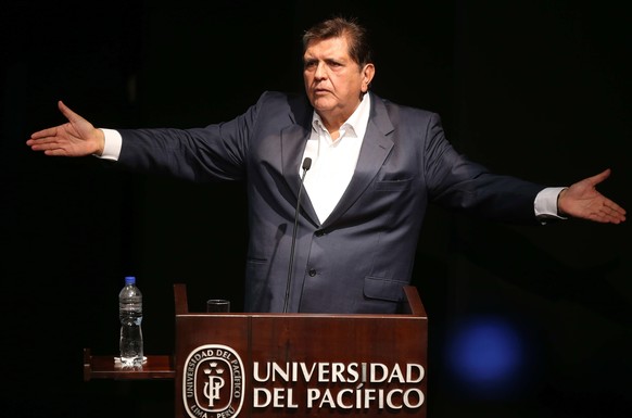 epa07512483 (FILE) - Peruvian presidential candidate for the party Alianza Popular (Popular Alliance) and former President of Peru Alan Garcia gestures during the introduction of his government plan a ...