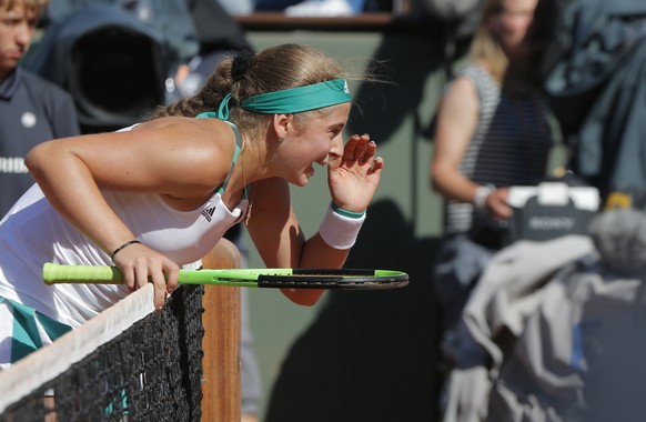 Latvia&#039;s Jelena Ostapenko reacts at the net as she plays Timea Bacsinszky of Switzerland during their semifinal match of the French Open tennis tournament at the Roland Garros stadium, Thursday,  ...