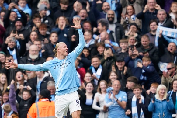 Manchester City&#039;s Erling Haaland celebrates after scoring his side&#039;s opening goal during the Premier League soccer match between Manchester City and Everton in Manchester, England, Saturday, ...