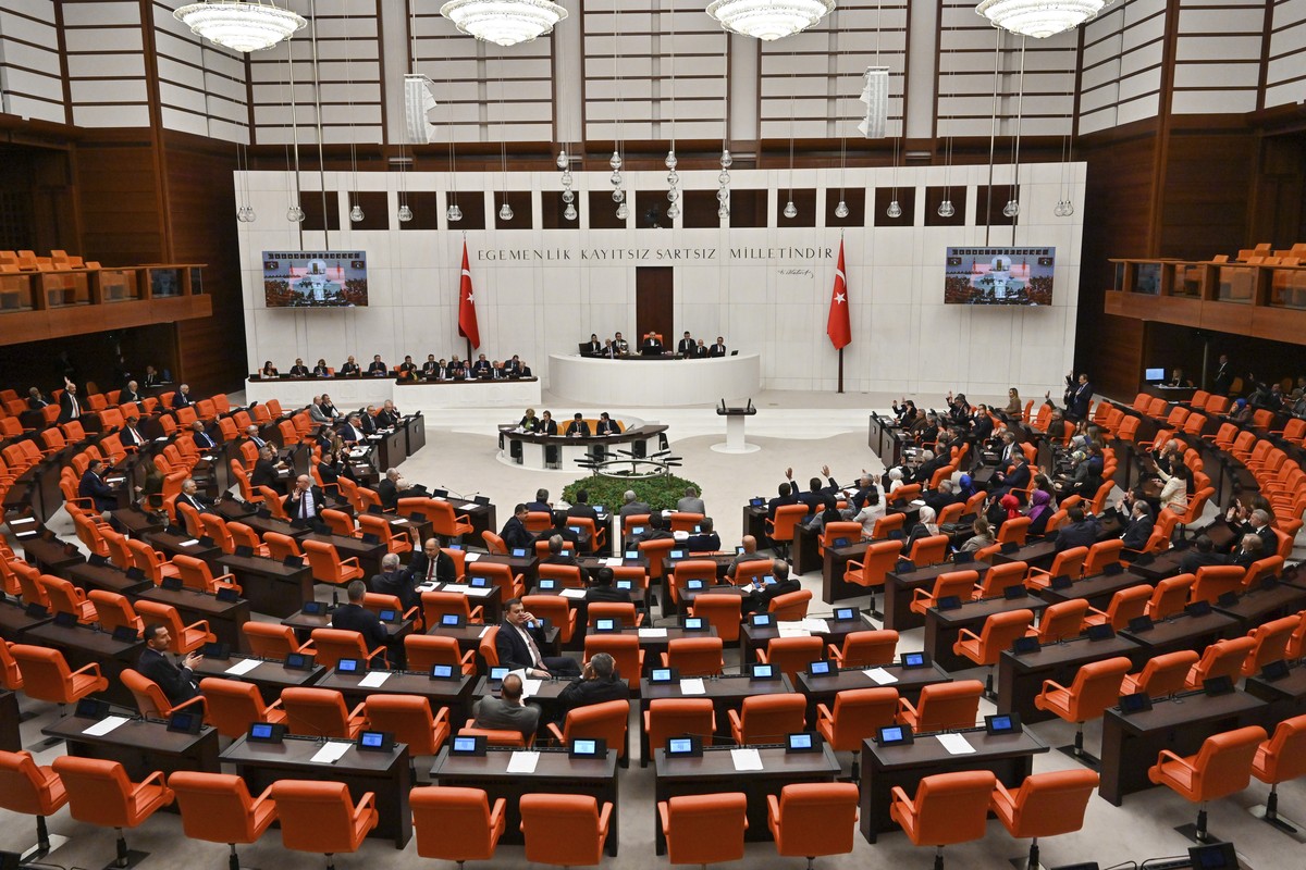Turkish lawmakers vote in favor of Finland's bid to join NATO late Thursday, March 30, 2023, at the parliament in Ankara, Turkey. All 276 lawmakers present voted unanimously in favor of Finland&# ...