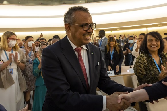 epa09972357 Tedros Adhanom Ghebreyesus, Director General of the World Health Organization (WHO) is congratulated by delegates after his reelection, during the 75th World Health Assembly at the Europea ...