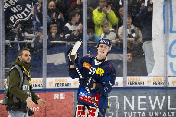 Ambri&#039;s Dario Wuethrich is comforted by his teammates and the fans after the National League regular season game between the HC Ambri Piotta and the SCL Tigers at the ice stadium Gottardo Arena,  ...