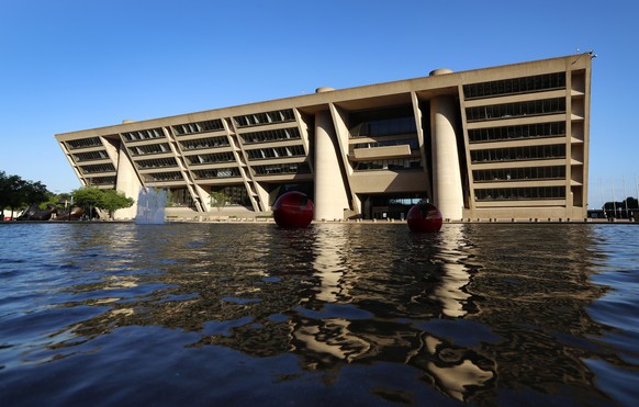 A reflecting pool sits in a large plaza on the walk up to Dallas City Hall, a building designed by architect I.M. Pei, in Dallas, Thursday, May 16, 2019. Pei, the globe-trotting architect who revived  ...