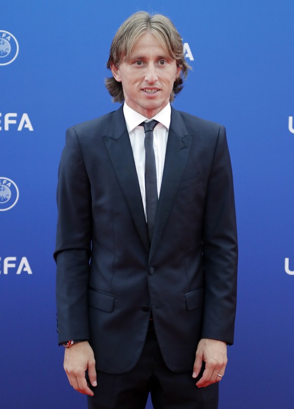 epa06984420 Croatian player Luka Modric of Real Madrid arrives for the UEFA Champions League Group Stage Draw and Awards in Monaco, 30 August 2018. EPA/GUILLAUME HORCAJUELO