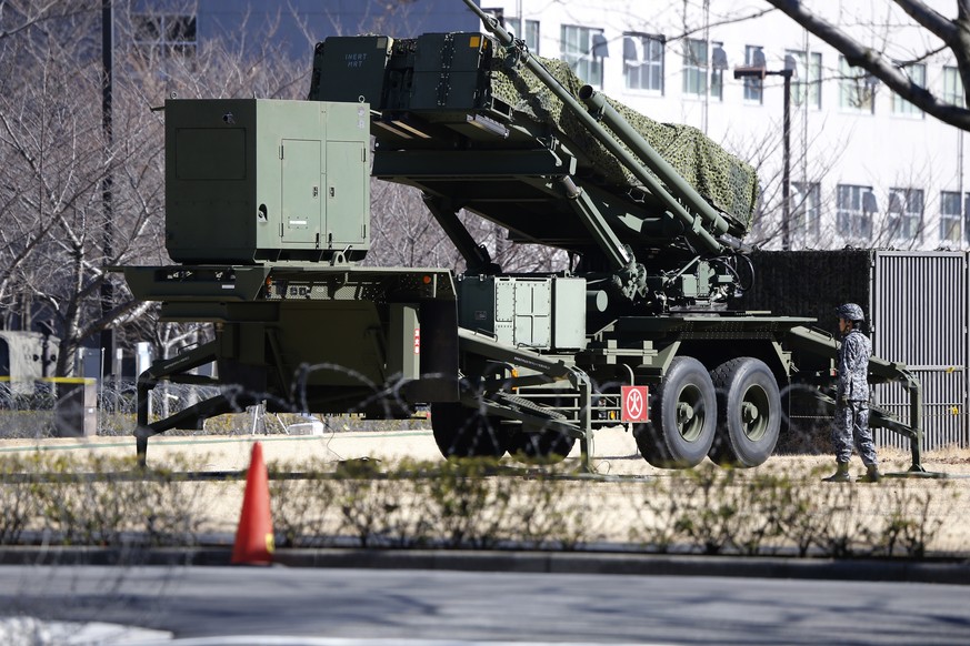 A Japan Self-Defense Force member stands by a PAC-3 Patriot missile unit deployed for North Korea&#039;s rocket launch at the Defense Ministry in Tokyo, Sunday, Feb. 7, 2016. North Korea on Sunday def ...