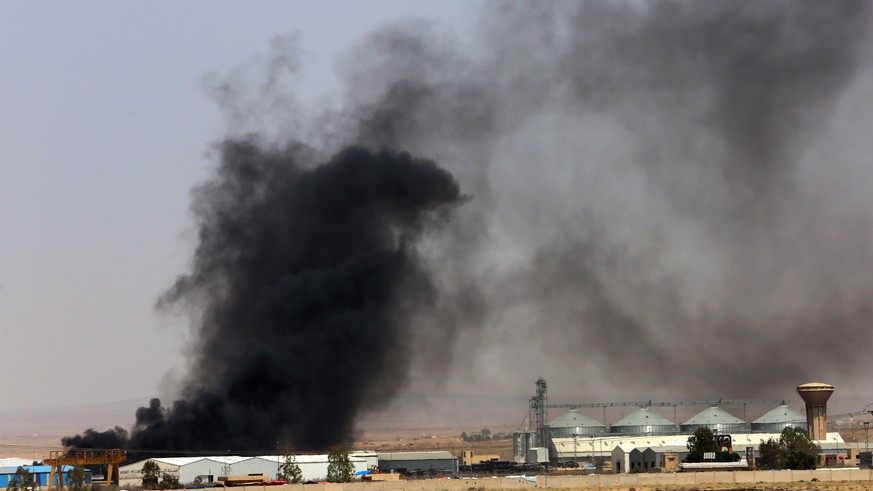 epa06863342 Smoke rises from the Syrian side at the Nasib Border Crossing between Jordan and Syria, about 80 kilometers north of Amman, Jordan, 03 July 2018 (issued 04 July 2018). The United Nation Hi ...