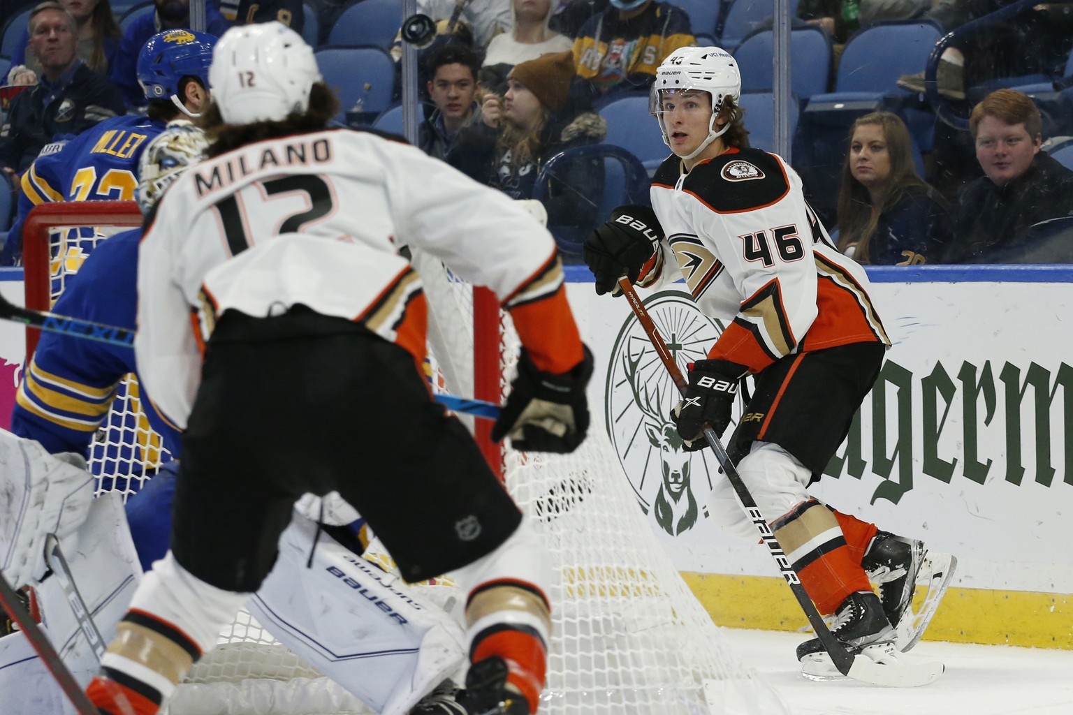 Anaheim Ducks center Trevor Zegras (46) flips the puck from behind the net to Sonny Milano, who scored, during the second period of an NHL hockey game against the Buffalo Sabres, Tuesday, Dec. 7, 2021 ...