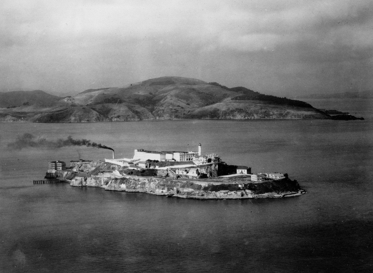 FILE In this Oct. 12, 1933 file photo, Alcatraz island is seen in San Francisco. At dusk the island prison that housed some of the nation&#039;s most notorious criminals including James &amp;#x201c;Wh ...