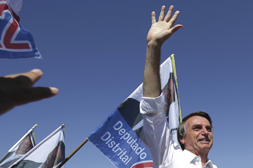 National Social Liberal Party presidential candidate Jair Bolsonaro greets supporters during a campaign rally in Brasilia&#039;s Ceilandia neighborhood, Brazil, Wednesday, Sept. 5, 2018. Brazilians go ...