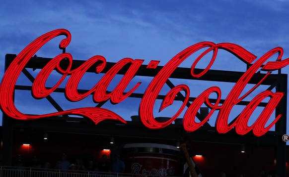 FILE - In this July 20, 2019, file photo a Coca-Cola billboard is shown over left field at SunTrust Park during a baseball game between the Washington Nationals and Atlanta Braves in Atlanta. The Coca ...