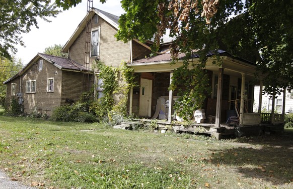 In this photo taken Oct. 11, 2014, an abandoned home in Kenton, Ohio. Long seen as having devastated Sun Belt cities, the subprime mortgage crisis unleashed turmoil on Ohio and other rural areas. Now  ...