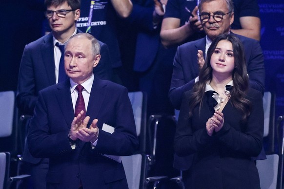 RUSSIA, REPUBLIC OF TATARSTAN - FEBRUARY 21, 2024: Russia s President Vladimir Putin L front, figure skater Kamila Valieva R front and football player Andrei Arshavin L back attend the opening ceremon ...