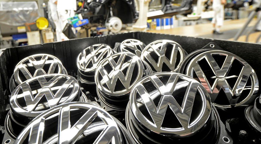 Emblems of VW Golf VII car are pictured in a production line at the plant of German carmaker Volkswagen in Wolfsburg, February 25, 2013. REUTERS/Fabian Bimmer/File Photo