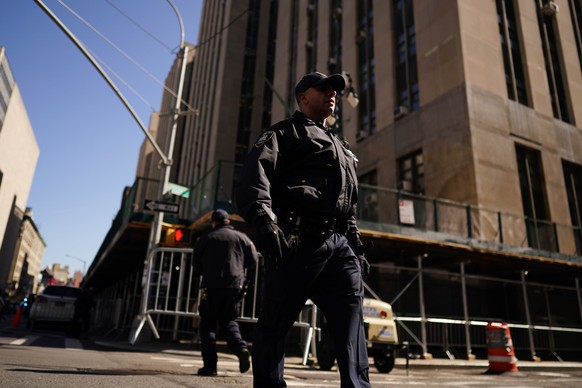 epa10557100 New York City police officers outside the New York Criminal Court in New York, New York, USA, 03 April 2023. A Manhattan grand jury voted to indict former president Donald J. Trump last we ...