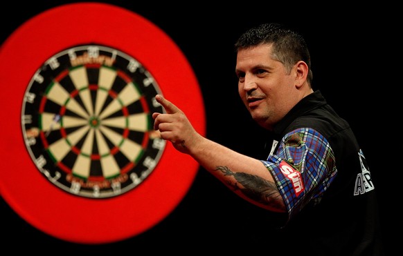 LONDON, ENGLAND - MAY 22: Gary Anderson of Scotland celebrates winning a leg during the McCoys Premier League Darts Play-Offs Semi Final match between Michael van Gerwen and Gary Anderson at O2 Arena  ...