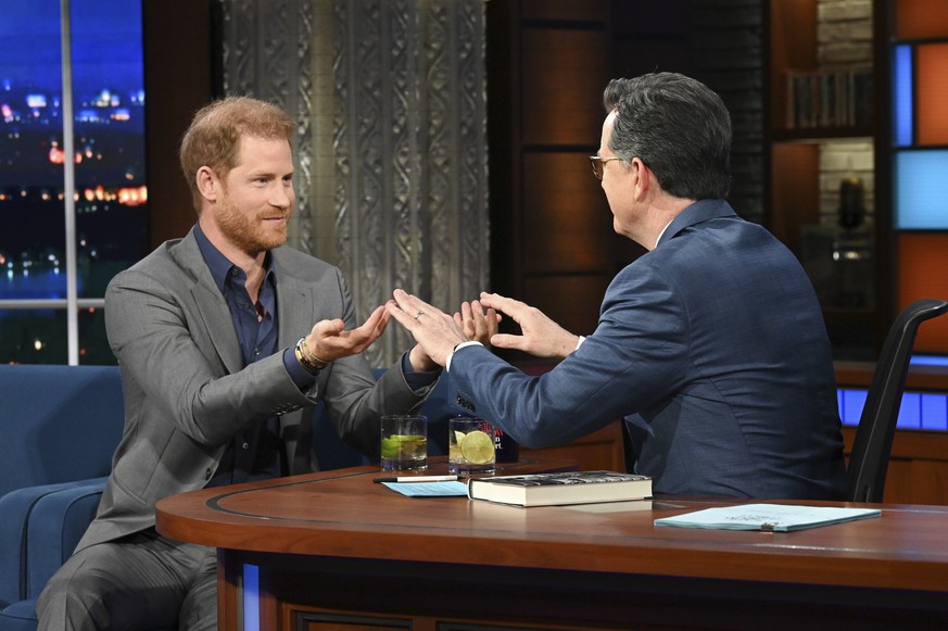 This image courtesy of CBS shows Prince Harry, left, with host Stephen Colbert during a taping of "The Late Show with Stephen Colbert" on Tuesday, January 10, 2023. (Scott Kowalchyk/CBS via AP)