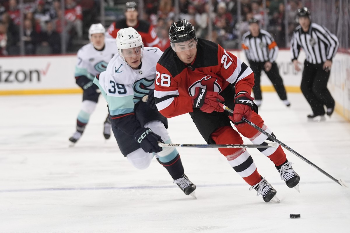 Seattle Kraken's Ryker Evans, left, chases New Jersey Devils' Timo Meier during the second period of an NHL hockey game in Newark, N.J., Monday, Feb. 12, 2024. (AP Photo/Seth Wenig)
Ryker Ev ...