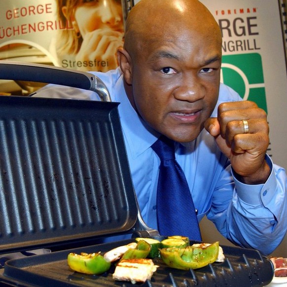 George Foreman, former world champion in heavy weight boxing, presents the new generation of his kitchen grill 'Big George' at a Karstadt department store in Dortmund, Germany, Tuesday, 25 O ...