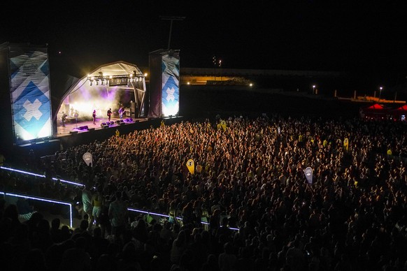 People attend the Cruilla music festival in Barcelona, Spain, Friday, July 9, 2021. (AP Photo/Joan Mateu)