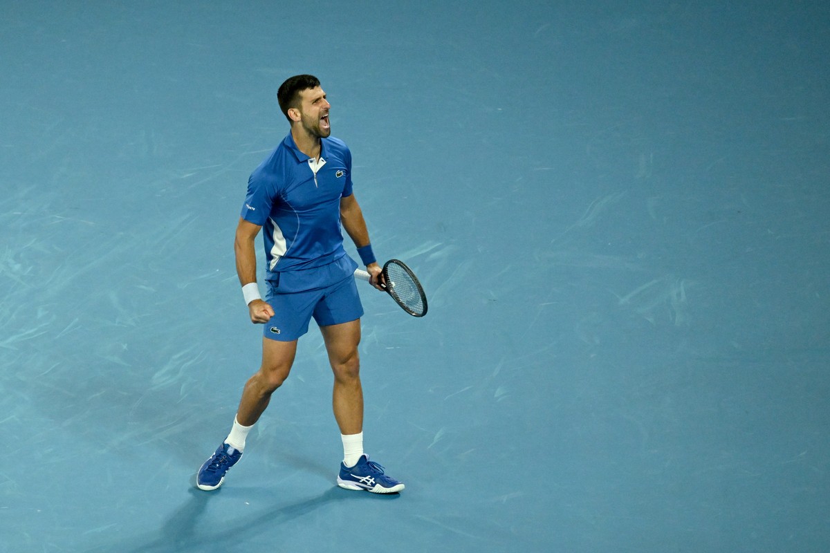 epa11085080 Novak Djokovic of Serbia celebrates match point during his round 2 win over Alexei Popyrin of Australia on Day 4 of the 2024 Australian Open at Melbourne Park in Melbourne, Australia, 17 J ...