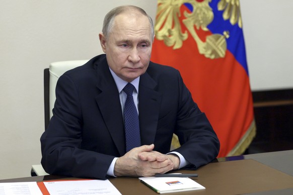 Russian President Vladimir Putin chairs a Security Council meeting via videoconference at the Novo-Ogaryovo state residence outside Moscow, Russia, Friday, Jan. 31, 2025. (Gavriil Grigorov, Sputnik, K ...