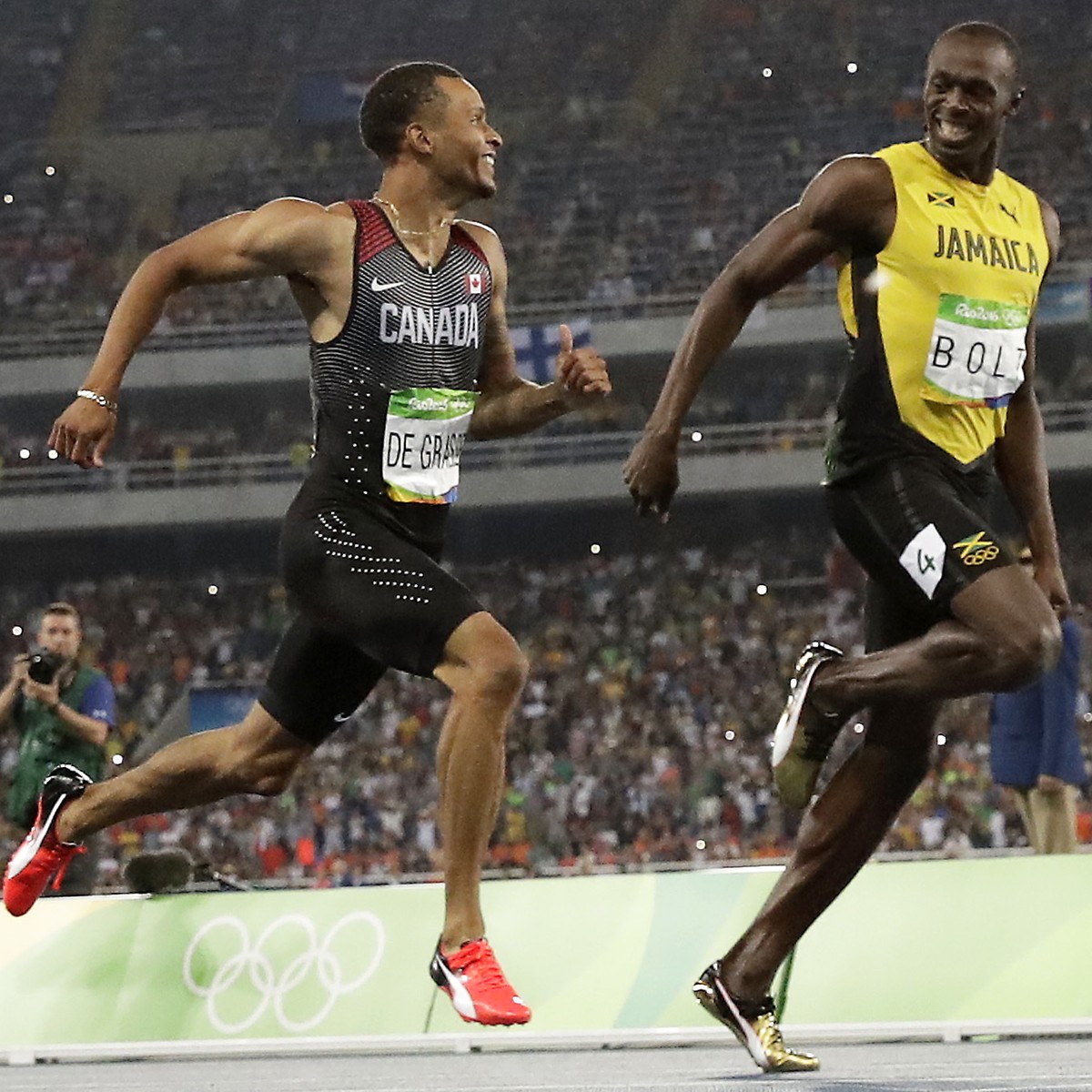 Canada's Andre De Grasse, left, and Jamaica's Usain Bolt during a men's 200-meter semifinal, during the athletics competitions of the 2016 Summer Olympics at the Olympic stadium in Rio  ...