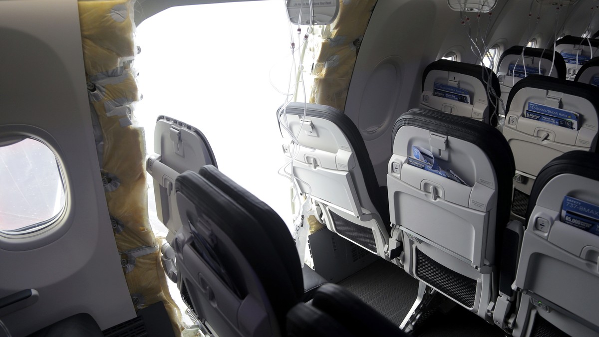 FILE - This photo released by the National Transportation Safety Board shows a gaping hole where the paneled-over door had been at the fuselage plug area of Alaska Airlines Flight 1282, Jan. 7, 2024,  ...