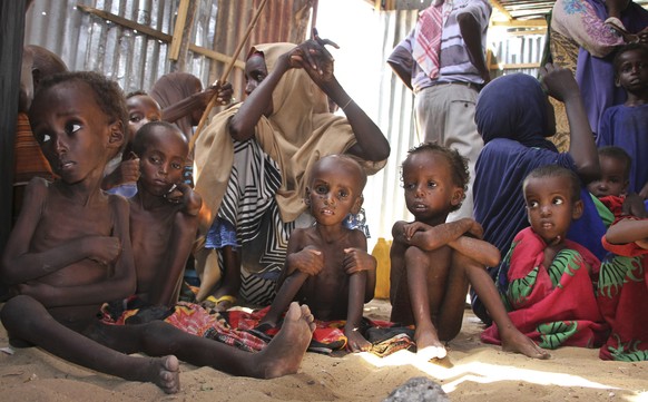 FILE - In this May 25, 2017, file photo, malnourished and displaced Somali children sit in a tent in their camp on the outskirts of Mogadishu, Somalia. Six African nations are among the 10 worst in th ...