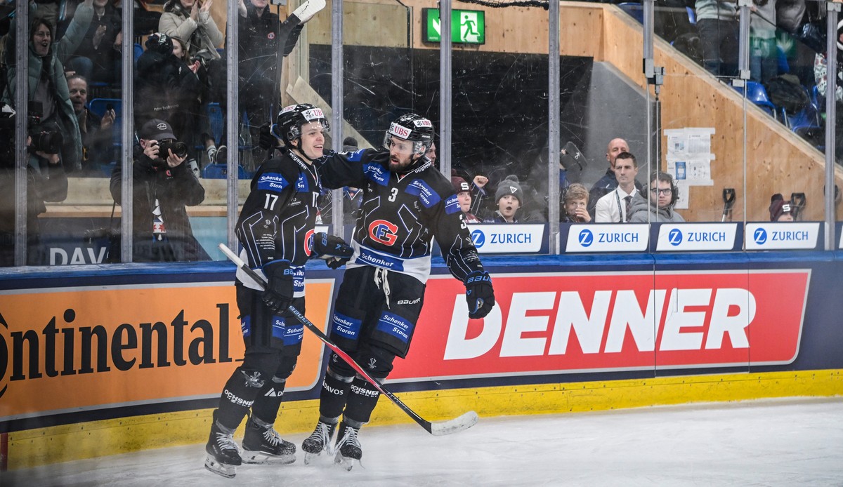 Fribourg's Attilio Biasca, left, celebrates after scoring with Fribourg's Michael Kapla during the game between HC Fribourg-Gotteron of Switzerland and HC Sparta Praha of Czech Republic, at  ...