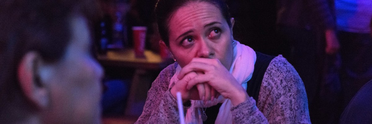 A woman reacts while watching a television displaying 2016 US presidential election coverage at the El Pinche Gringo bar in Mexico City, Mexico. Bloomberg / Getty Images