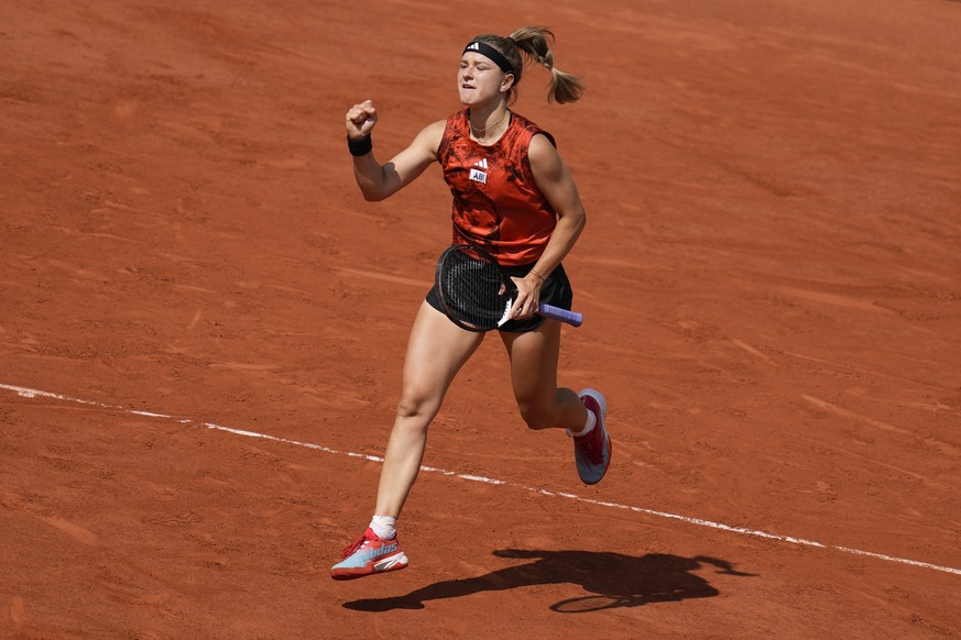 Karolina Muchova of the Czech Republic clenches her fist after winning the first set against Aryna Sabalenka of Belarus during their semifinal match of the French Open tennis tournament at the Roland  ...