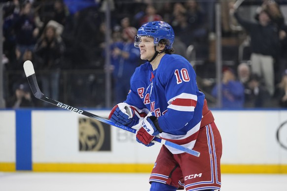 New York Rangers left wing Artemi Panarin (10) skates toward his bench after scoring a goal during the third period of an NHL hockey game against the Vegas Golden Knights Sunday, Feb. 2, 2025, in New  ...