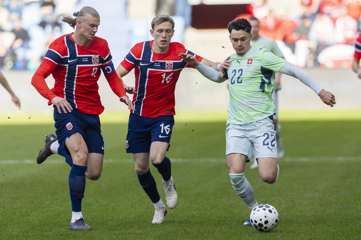 Norway's Erling Haaland, left, Norway's Marcus Pedersen, center, and Switzerland's Fabian Rieder, right, fight for the ball, during a friendly soccer match between Norway and Switzerlan ...