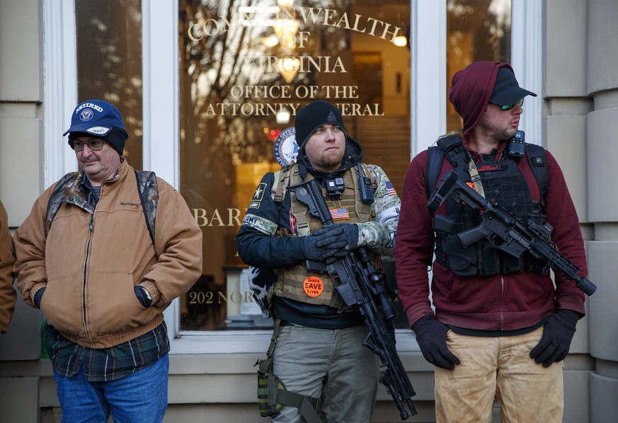 epa08144522 Gun-rights supporters gather for a rally outside the Virginia state capitol in Richmond, Virginia, USA, 20 January 2020. Virginia Citizens Defense League organized the rally to lobby again ...