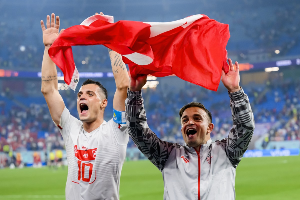 Switzerland's midfielder Granit Xhaka and Switzerland's midfielder Xherdan Shaqiri celebrate the victory and the qualification during the FIFA World Cup Qatar 2022 group G soccer match betwe ...