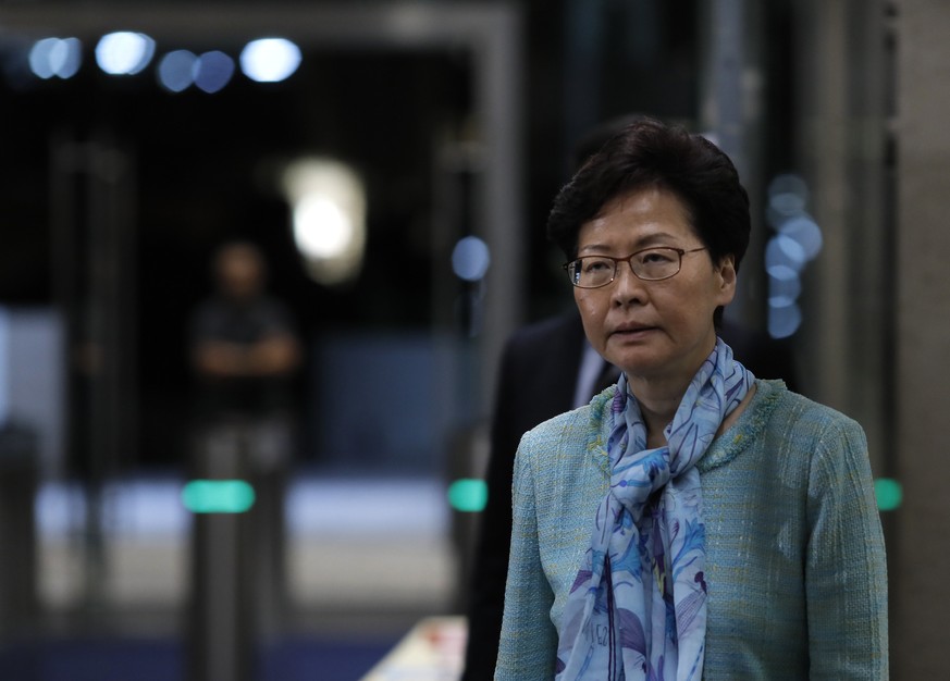 Hong Kong Chief Executive Carrie Lam listens to reporters questions during a press conference in Hong Kong, Tuesday, July 2, 2019, after hundreds of protesters in Hong Kong swarmed into the legislatur ...
